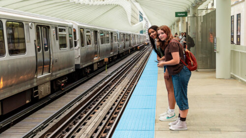 two girls waiting for a train