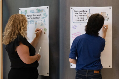 attendees leave feedback on activity boards
