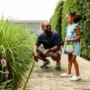 father and daughter in a garden
