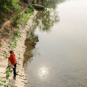 a man standing by a river