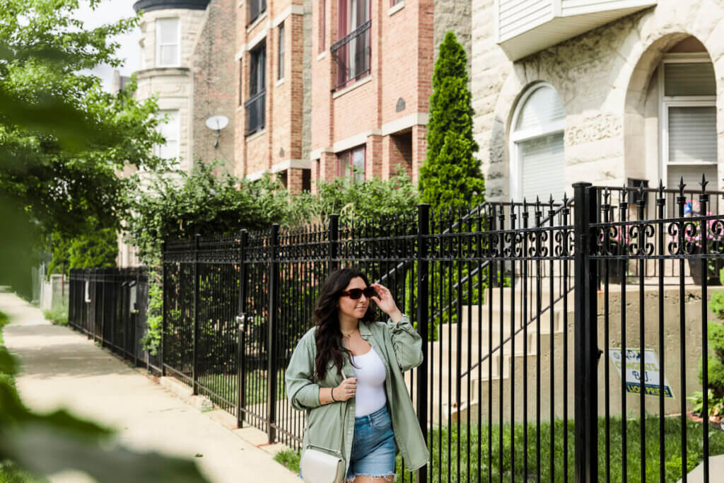 Woman walking by housing